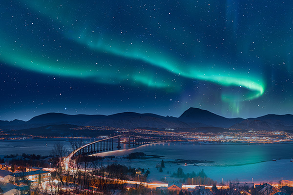Aurora borealis or Northern lights in the sky over Tromso