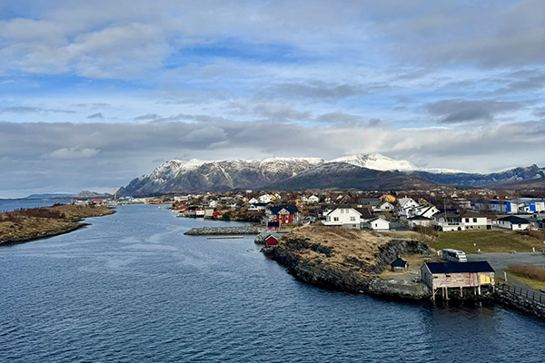 View of the snowy mountains of Bronnoysund from the top deck on MS Trollfjord in Norway